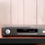 What is the difference between an integrated amp and a receiver?